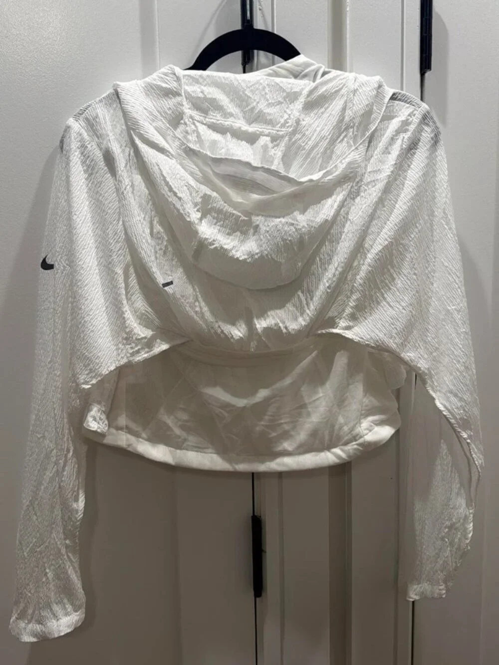 Nike white cover jacket with subtle textured pattern